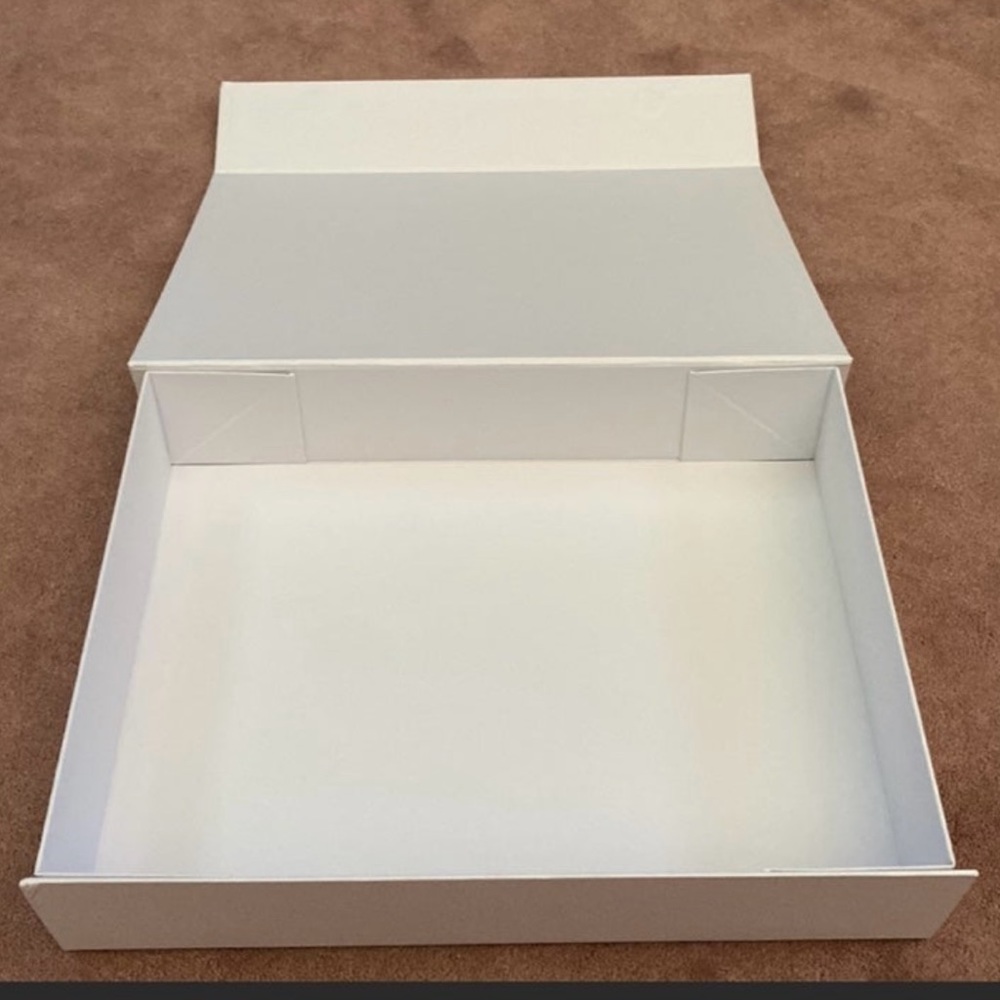 Elegant large Johnny Was empty gift box.
14”x10”x3” with magnetic closure. NWOT - Picture 2 of 4